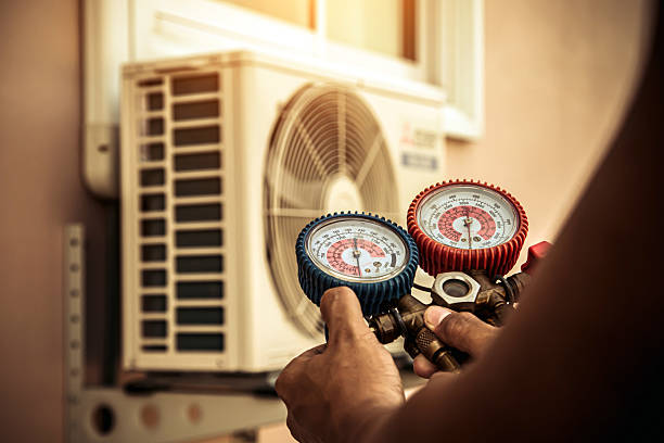 Professional Air Conditioning Service technician working in Cedar Hill, MO